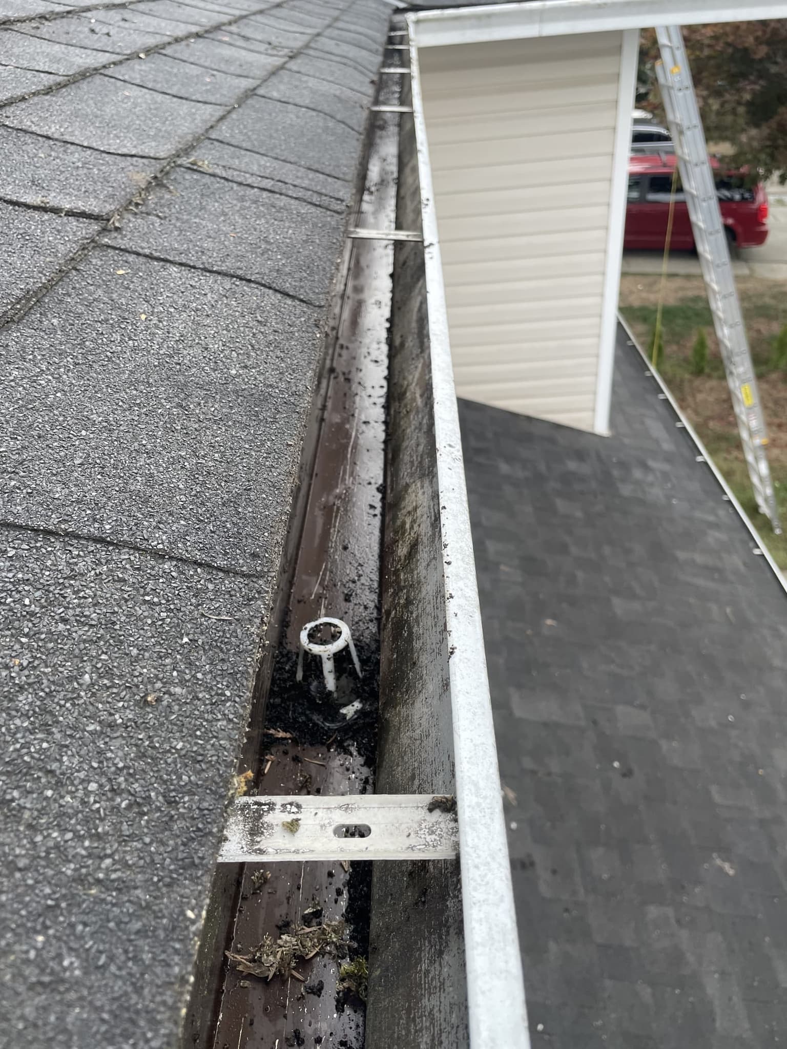 After: cleared downspout and gutter